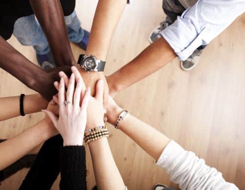 Group with hands together