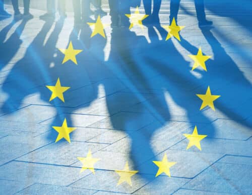 EU Flag and shadows of People concept picture